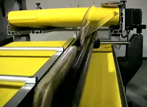 Package Upending conveyor with plexi guide