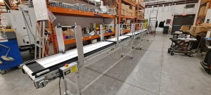 Long Line Assembly Conveyor with Adjustable Lane Dividers - overhead gantry