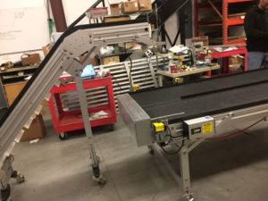 Z counting box conveyor with incline