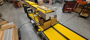 Double counting and boxing conveyor on factory floor