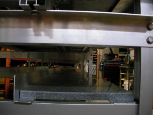 Storage shelf work station conveyor