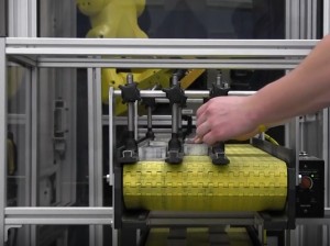 over under packaging conveyor with robotic interface