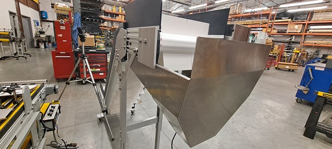 custom built aluminum hopper for elevator packaging conveyor