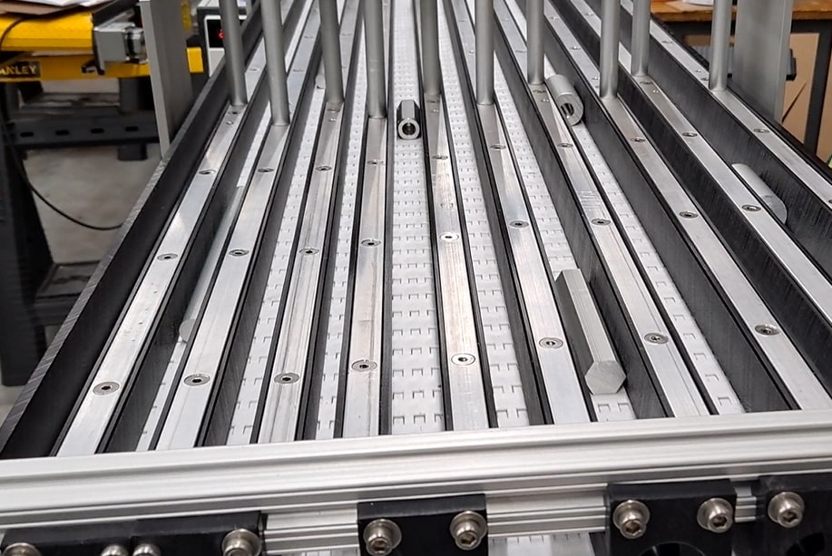 Machined Parts Over - Under Conveyors - A Robotic Interface Systems