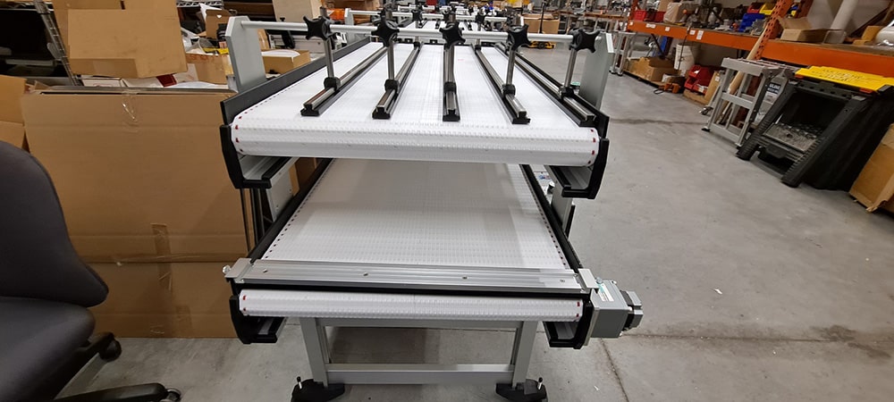 multi lane over under robotic conveyor system 